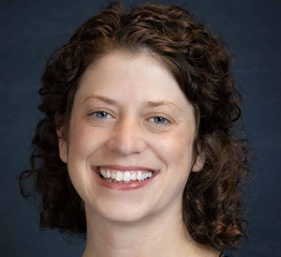 Gonzaga's mascot Spike flexs for the camera during a basketball game.